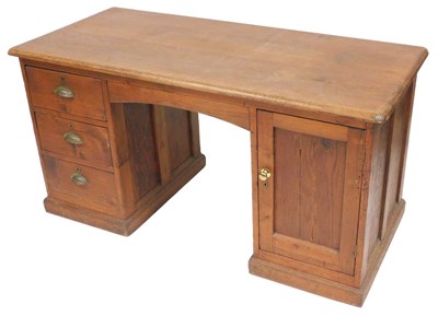 Lot 585 - An early 20thC pine twin pedestal desk, with...