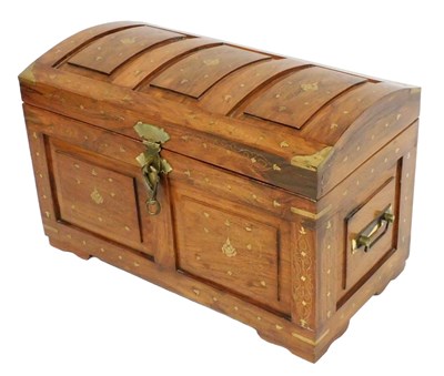 Lot 604 - An Omani hardwood dome top blanket chest, with...
