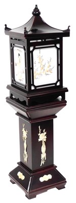 Lot 605 - A late 20thC Chinese lacquered pedestal...