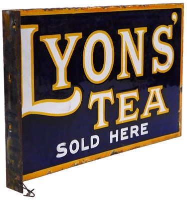 Lot 546 - An early 20thC enamel Lyon's Tea angular wall...