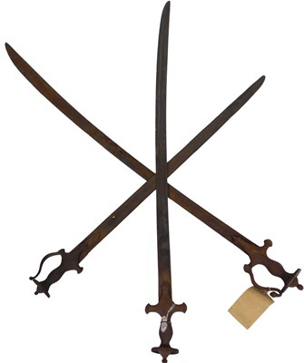 Lot 565 - Three Indian swords with iron grips and...