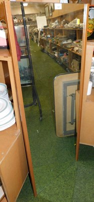 Lot 1221 - A 1950s rectangular framed wall mirror.