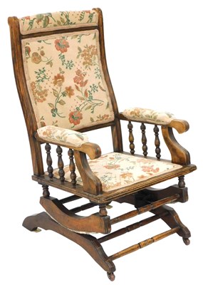 Lot 626 - An American beech wood rocking chair, with...