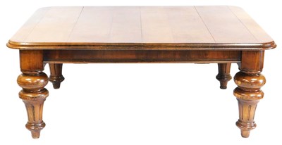 Lot 627 - A Victorian oak pull-out dining table, raised...