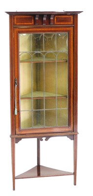 Lot 629 - An Edwardian mahogany corner display cabinet,...