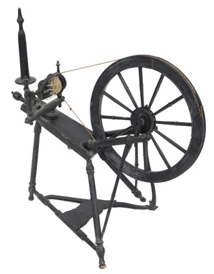 Lot 635 - A 19thC ebonised spinning wheel, 83cm wide.