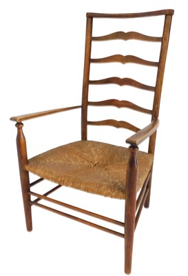 Lot 674 - An Arts & Crafts oak and beech ladder back...