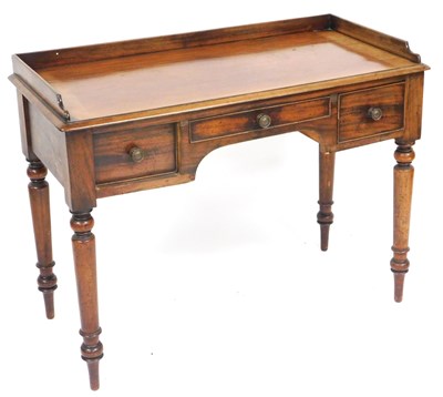 Lot 677 - A Victorian mahogany writing table, galleried...