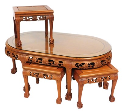 Lot 644 - A Chinese hardwood nest of occasional tables,...