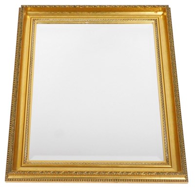Lot 645 - A rectangular gilt wood wall mirror, with a...