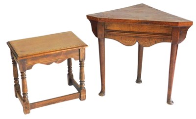 Lot 679 - A 19thC oak corner table, with a shaped frieze,...