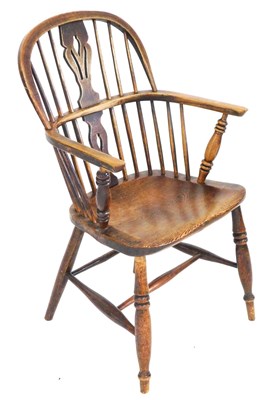 Lot 685 - A 19thC oak and elm Windsor chair, with a vase...