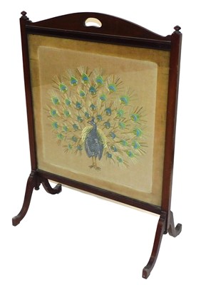 Lot 692 - A Victorian mahogany firescreen, the central...