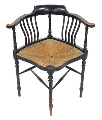 Lot 653 - A Victorian ebonised and rush seated corner...