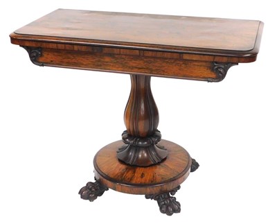 Lot 661 - A Regency rosewood fold over tea table, raised...