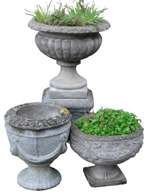 Lot 743 - A concrete garden urn, of semi fluted form,...