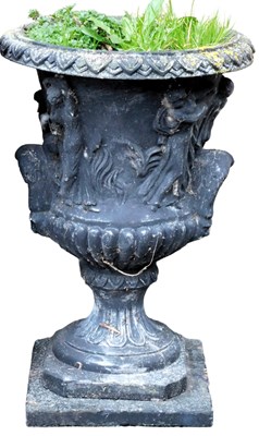 Lot 745 - A black painted concrete garden urn, of semi...