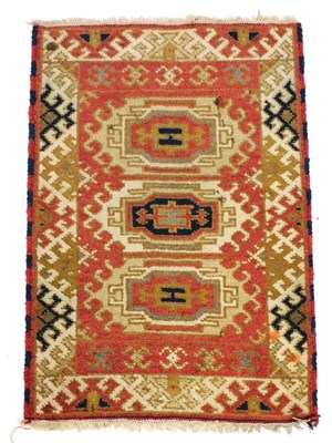 Lot 755 - A Kazak red ground prayer rug, with three...
