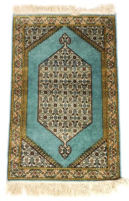 Lot 756 - A Kashan prayer rug, with a central flower...