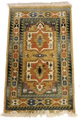 Lot 757 - A Turkish light brown prayer rug, the central...