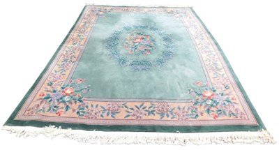Lot 761 - A Chinese blue ground rug, decorated with...