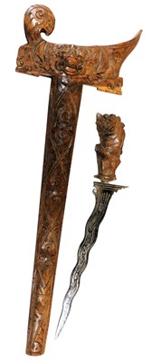 Lot 233 - A 19thC Indonesian Kris, with a carved beast...