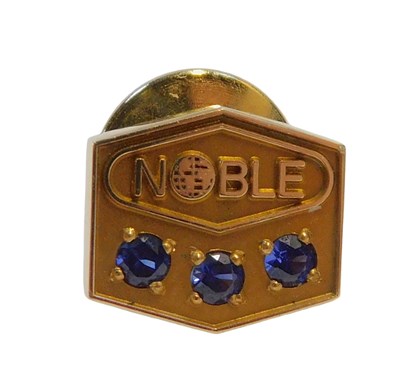 Lot 243 - A Noble tie pin, set with three sapphires,...