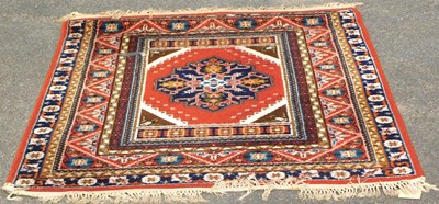 Lot 1225 - A St Michael Axminster red ground rug, 198cm x...