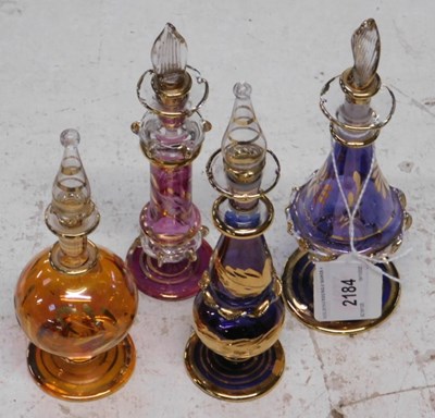 Lot 2184 - Four coloured glass Eastern-inspired scent...
