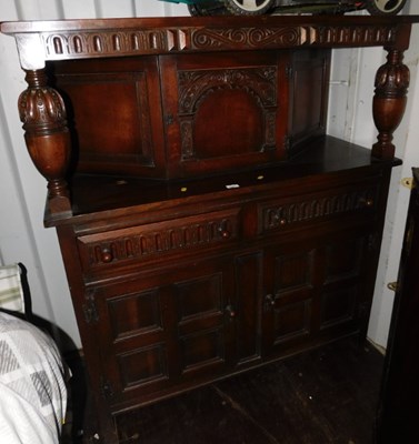 Lot 1069 - A mid century oak court cupboard, 138cm high,...