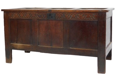 Lot 818 - A 17thC oak coffer, the panelled top enclosing...