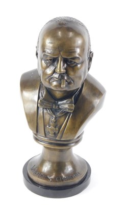 Lot A cast and brown patinated spelter bust of...