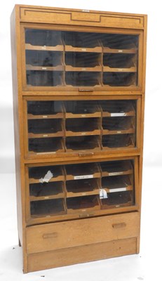Lot An early-to-mid 20thC light oak haberdashery...