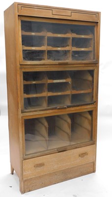 Lot An early-to-mid 20thC light oak haberdashery...