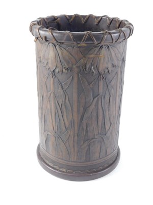 Lot An Arts & Crafts leather bound umbrella stand,...