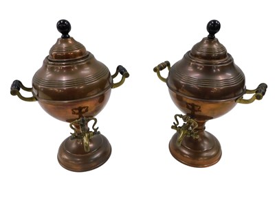 Lot 333 - Two copper Samovars, each with an ebonised...