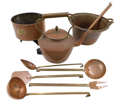 Lot 401 - A selection of copper and brass ladles, a...