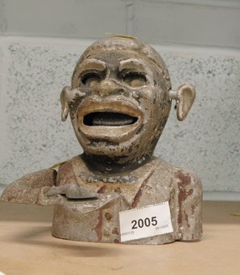 Lot 2005 - A cast aluminium money box.