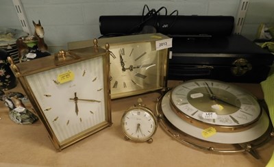 Lot 2013 - A group of brass quartz clocks, two mounted,...