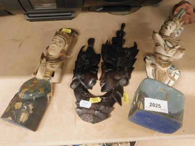 Lot 2025 - A selection of carved wooden Eastern deities.