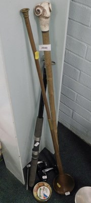 Lot 2049 - A walking stick, with ram's head handle, a...