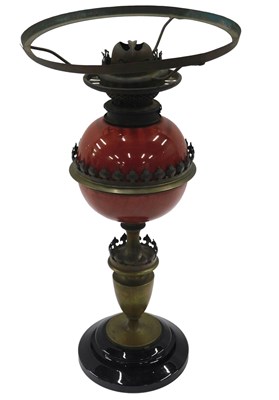 Lot 451 - An early 20thC brass oil lamp, with red...