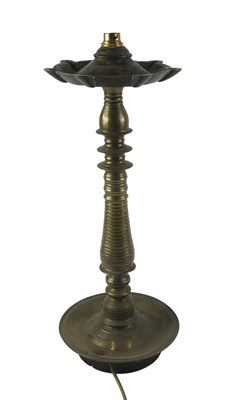 Lot 120 - A brass table lamp, with shaped top, on a...