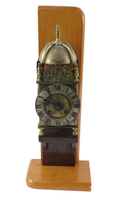 Lot 121 - A brass lantern clock, with bell and brass...