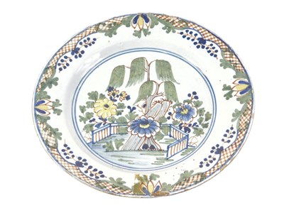 Lot 163 - A 18thC London Delft plate, on a blue tin...