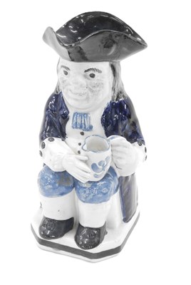 Lot 454 - A 20thC character jug, depicting figure with...