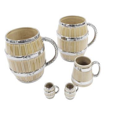 Lot 458 - A set of Wade ceramic tankards, each with...