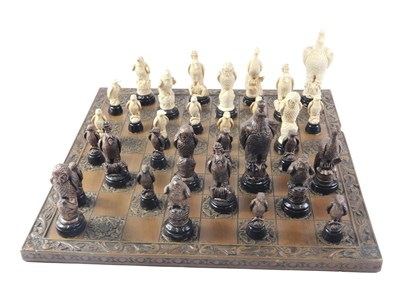 Lot 229 - A composite chess set, the resin board with...