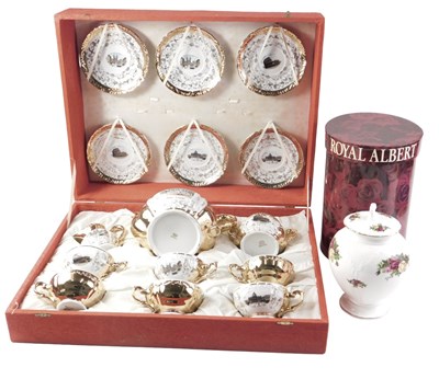 Lot 234 - A Bavarian china cased tea set, depicting...