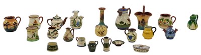 Lot 500 - A collection of Torquay Mottoware, comprising...